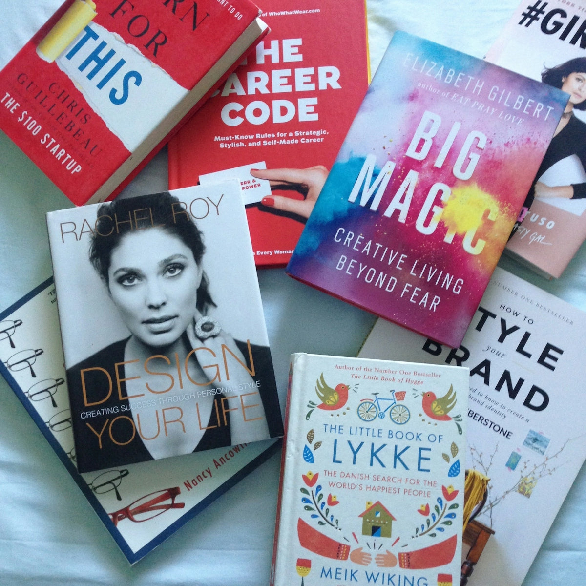 Books on design, career, and self-improvement are shown
