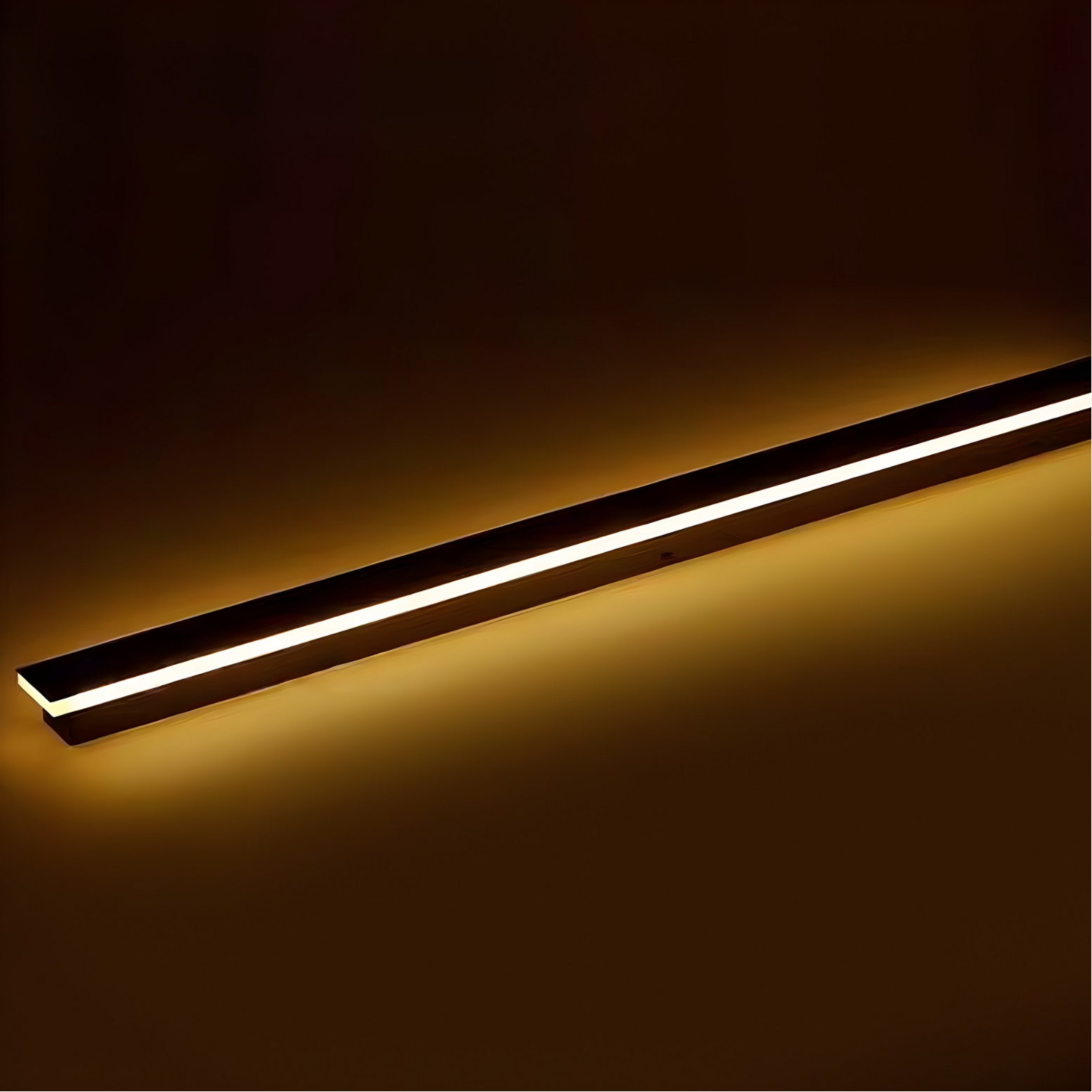 Linear LED light fixture on a dark background