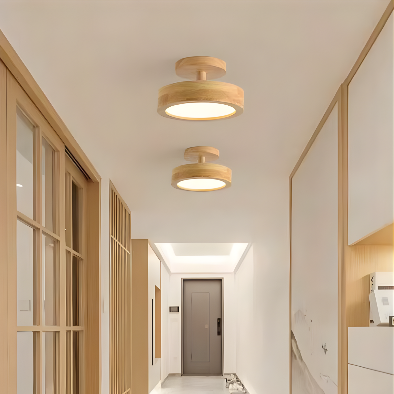 Modern hallway with wooden ceiling lights and light-colored walls.