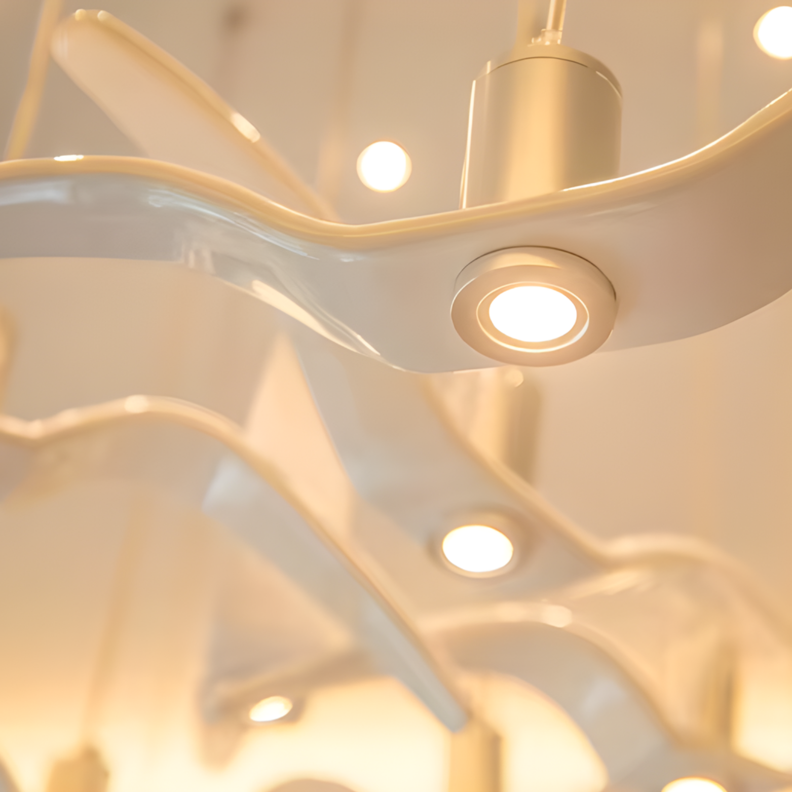 Close-up of a modern ceiling light fixture with a warm glow.