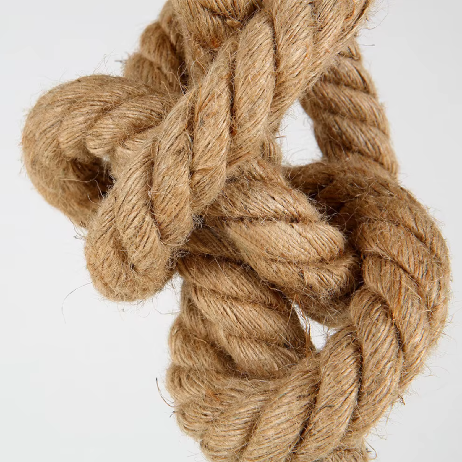 Close-up of a braided rope on a white background