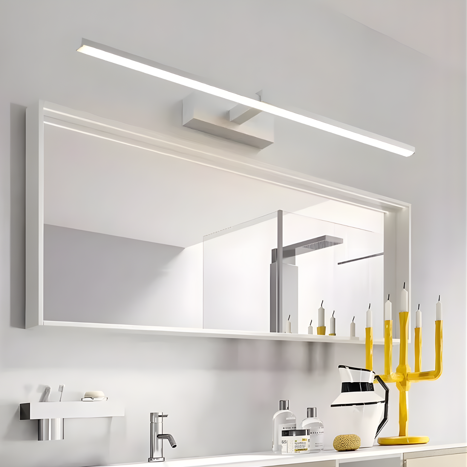Bathroom with a large mirror and modern lighting fixtures.