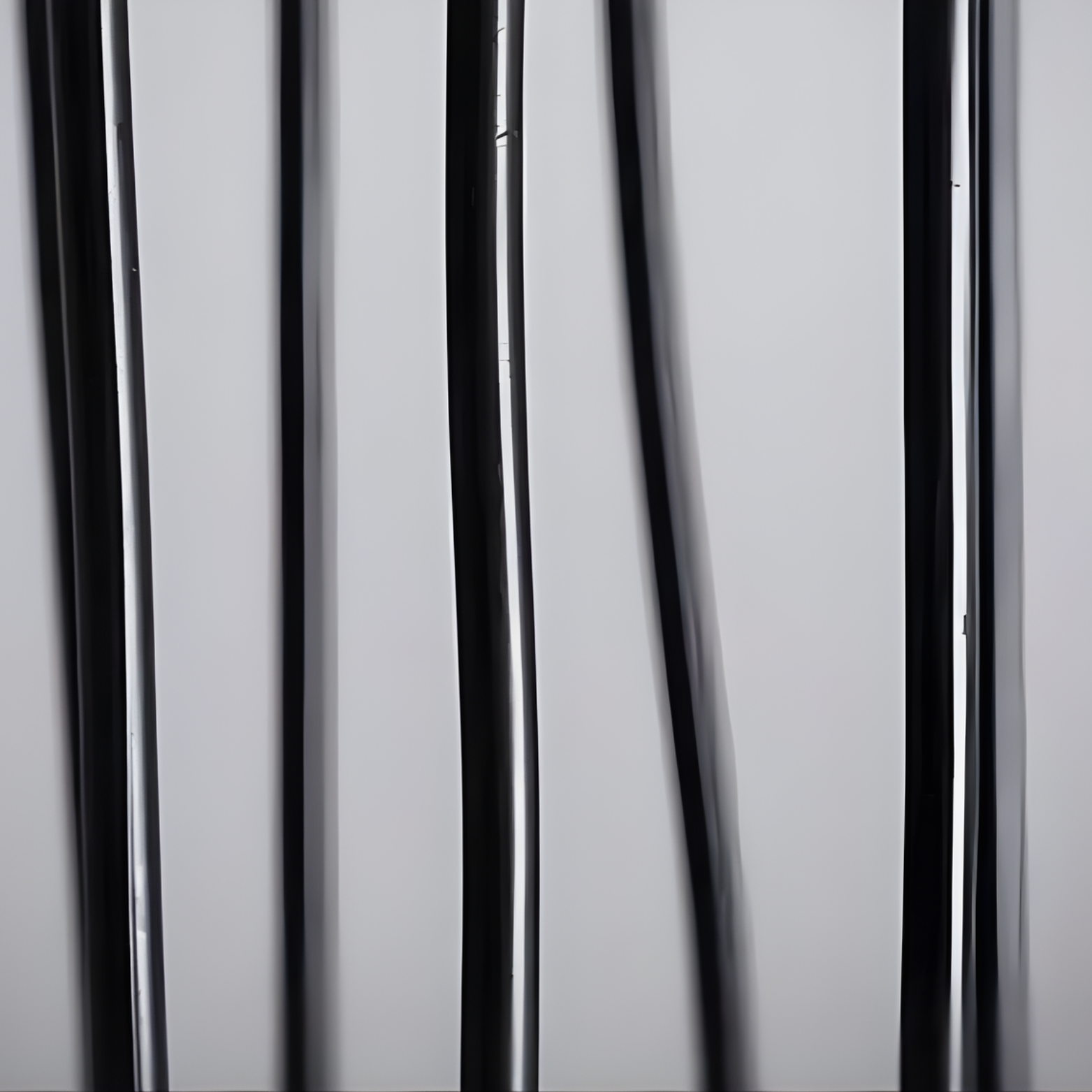Close-up of a shower curtain with vertical pleats on a neutral background