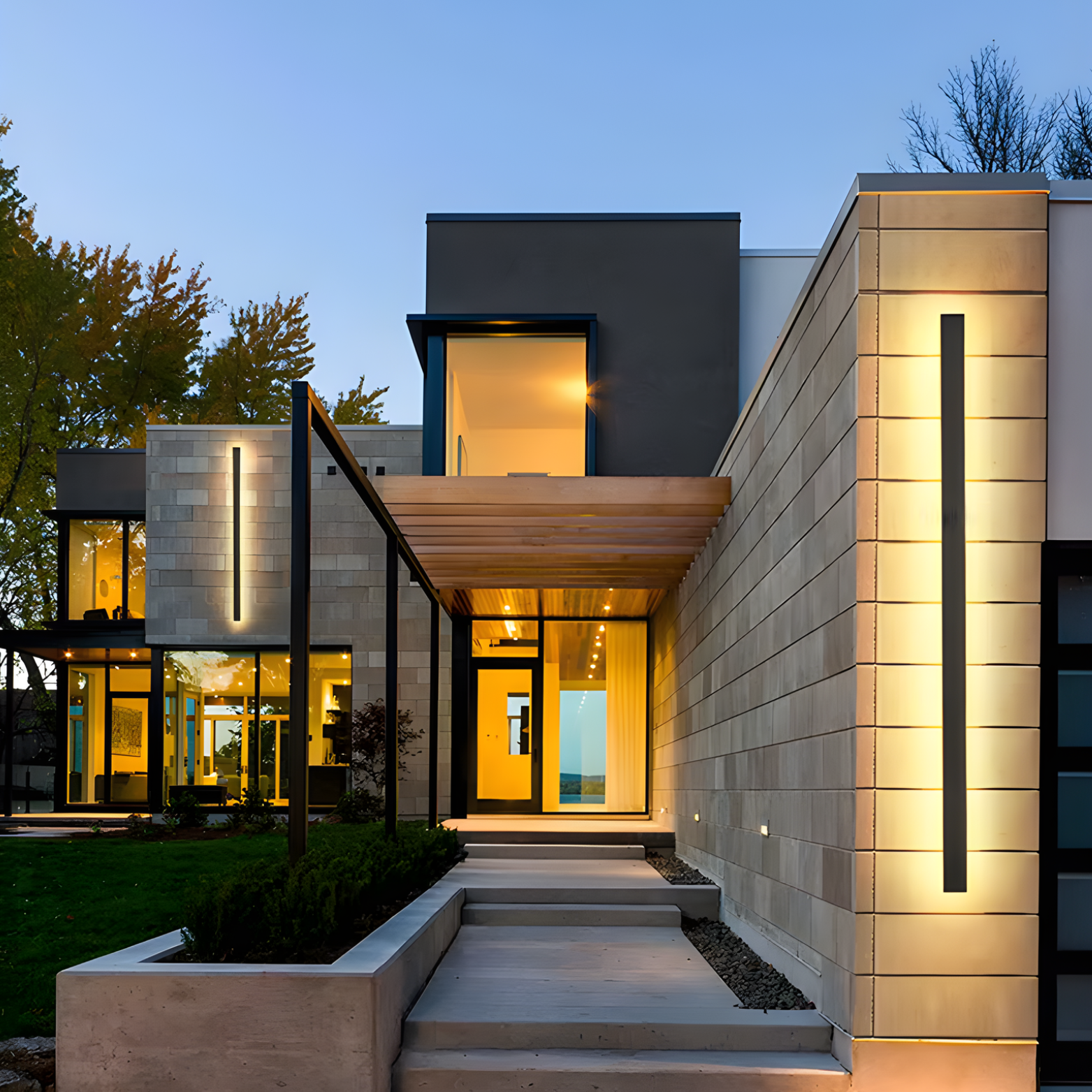 Modern house exterior with illuminated windows and decorative lighting