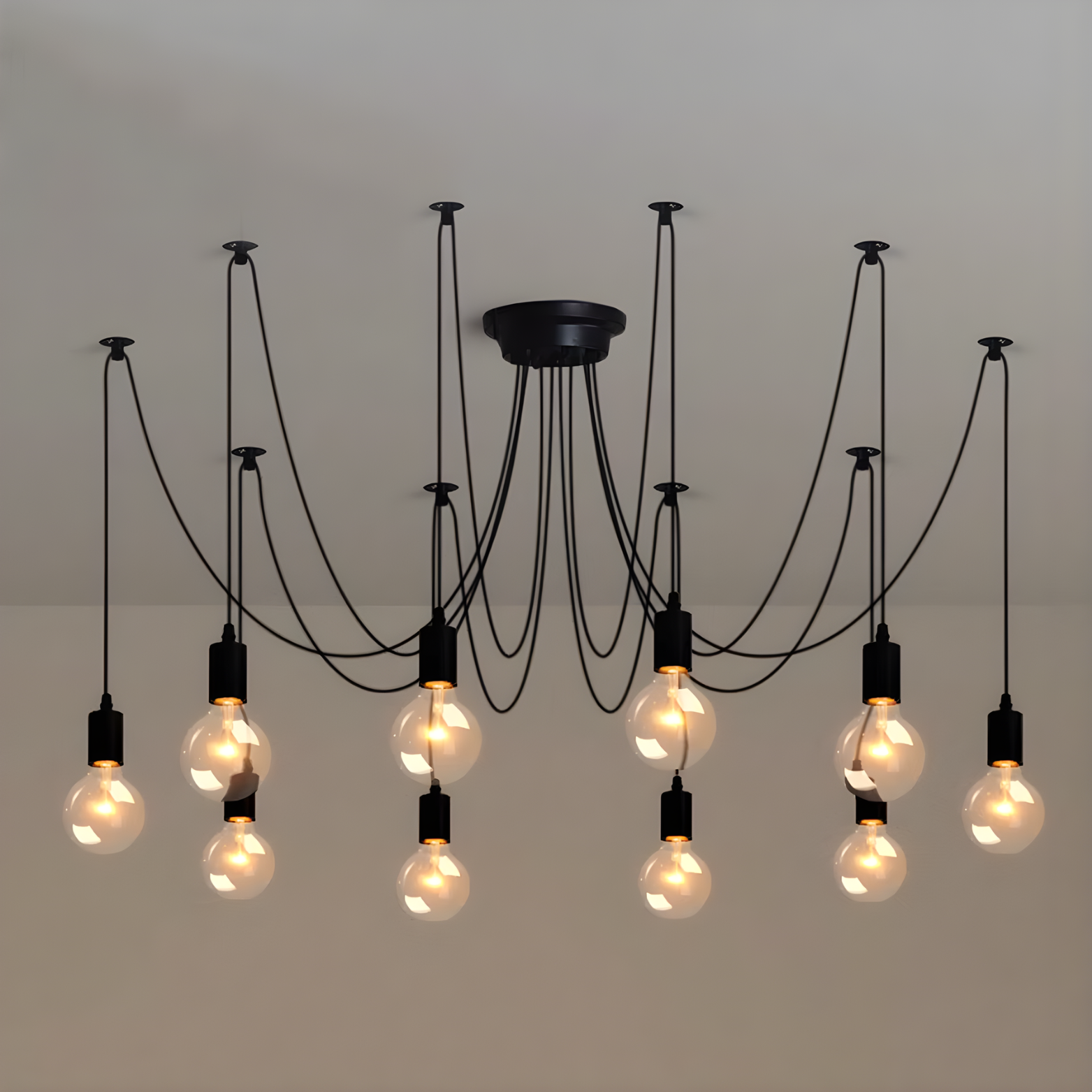 Modern chandelier with multiple hanging light bulbs on a neutral background