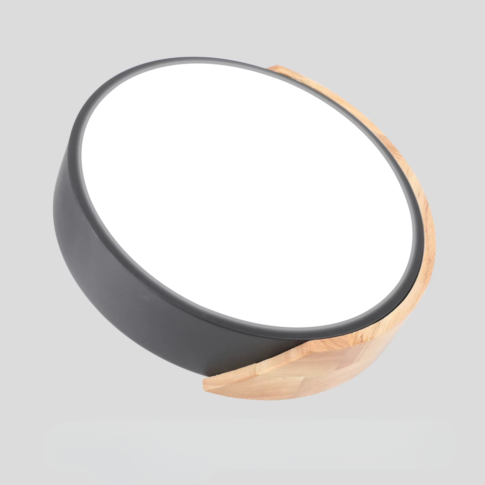 Round light fixture with black and wood finish on a gray background