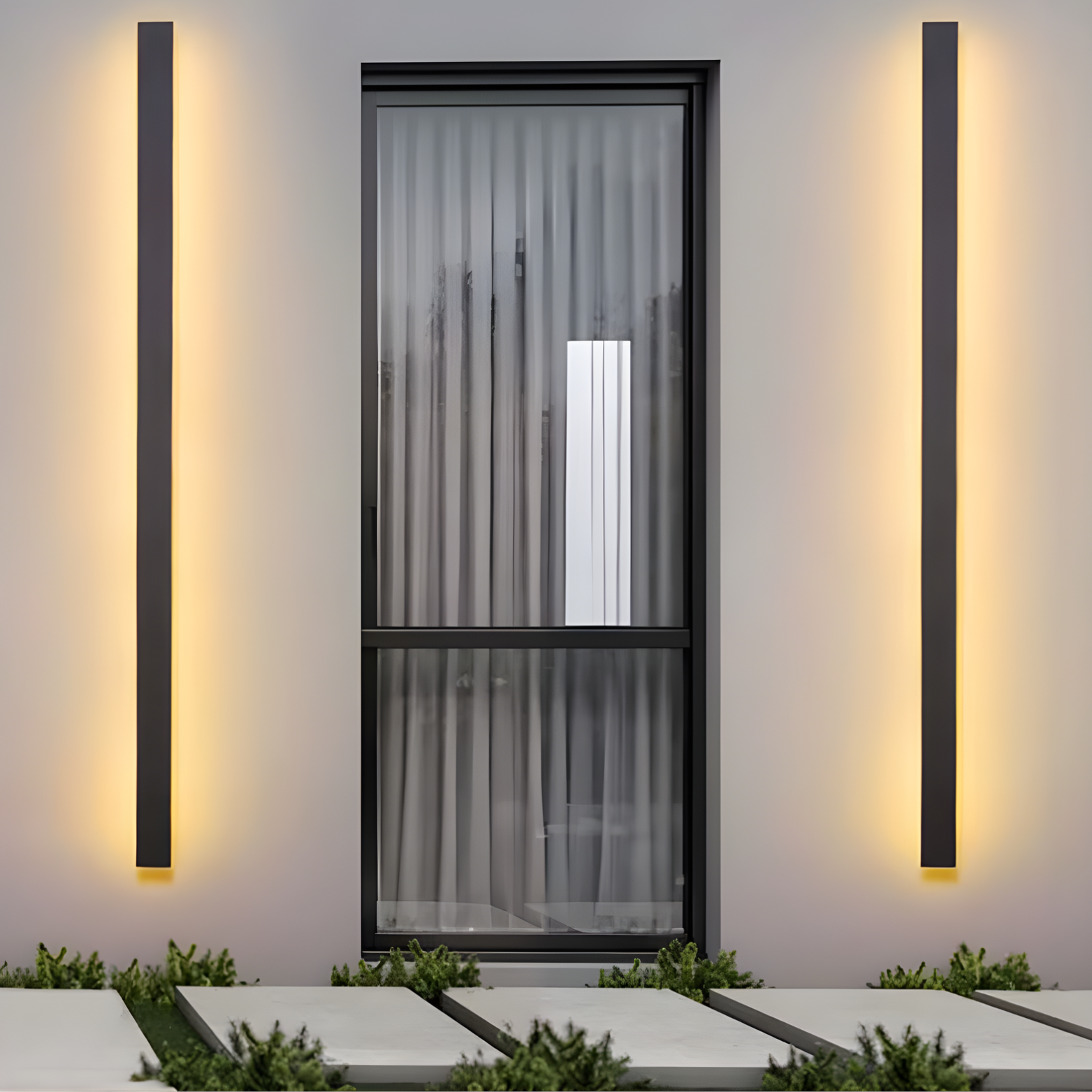 Modern outdoor lighting fixtures on a wall with a door in the background