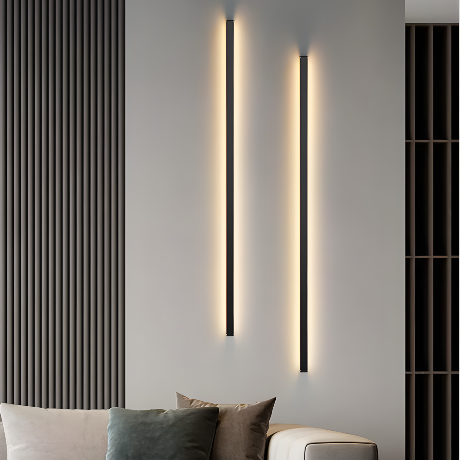 Modern wall lights on a gray wall with a sofa and cushions in the foreground