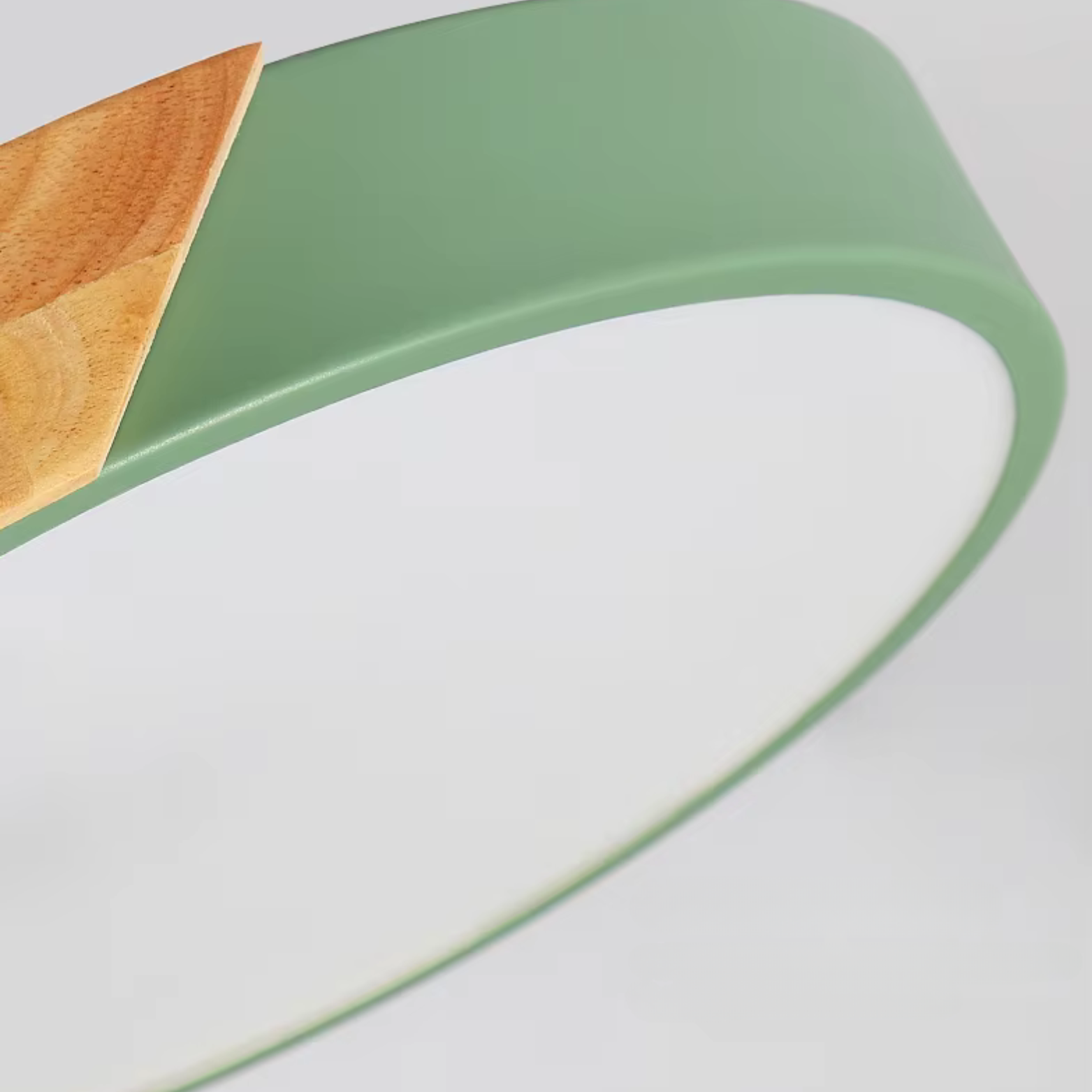 Close-up of a green and white chair with a wooden seat on a light gray background