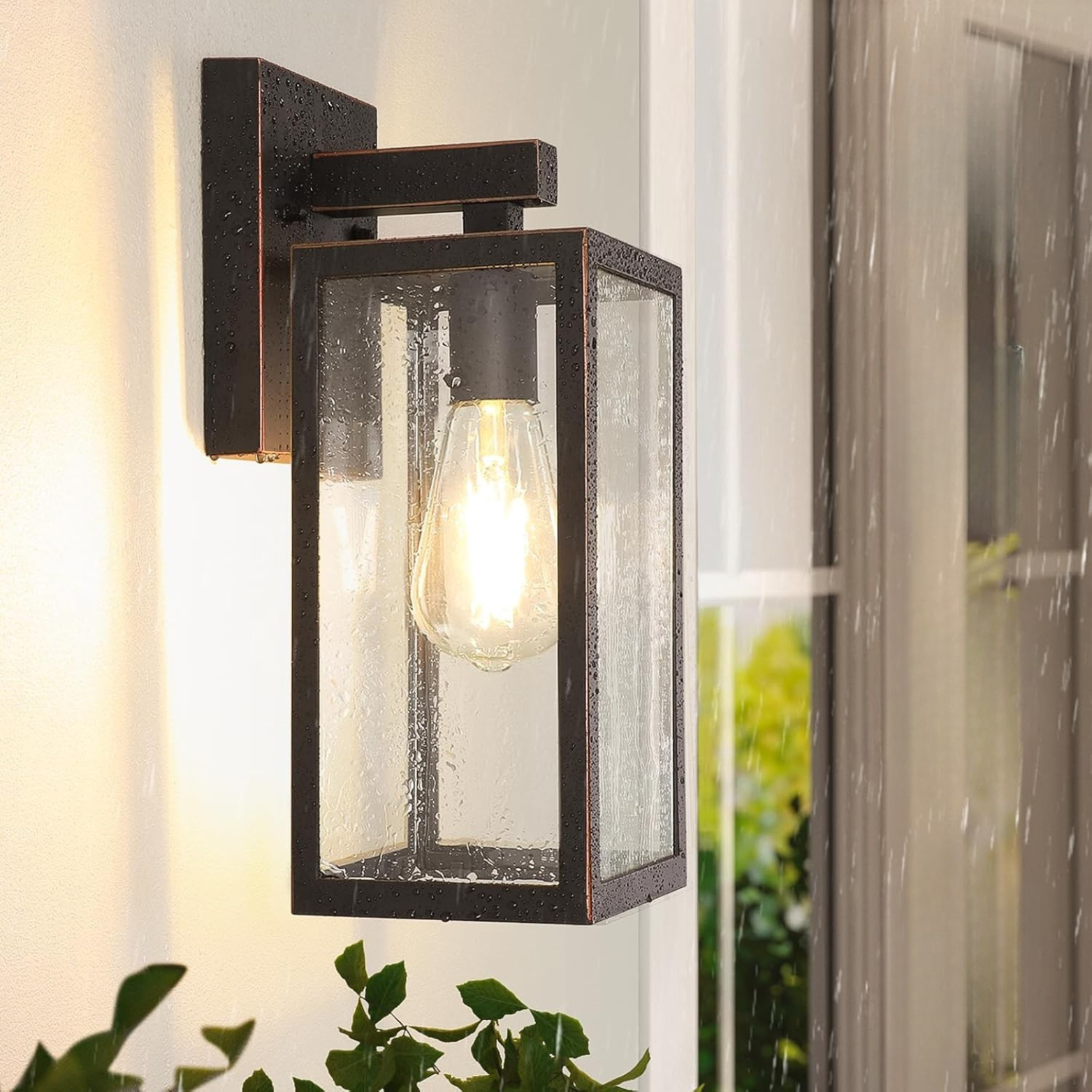 Outdoor wall light fixture with glass cover on a wall