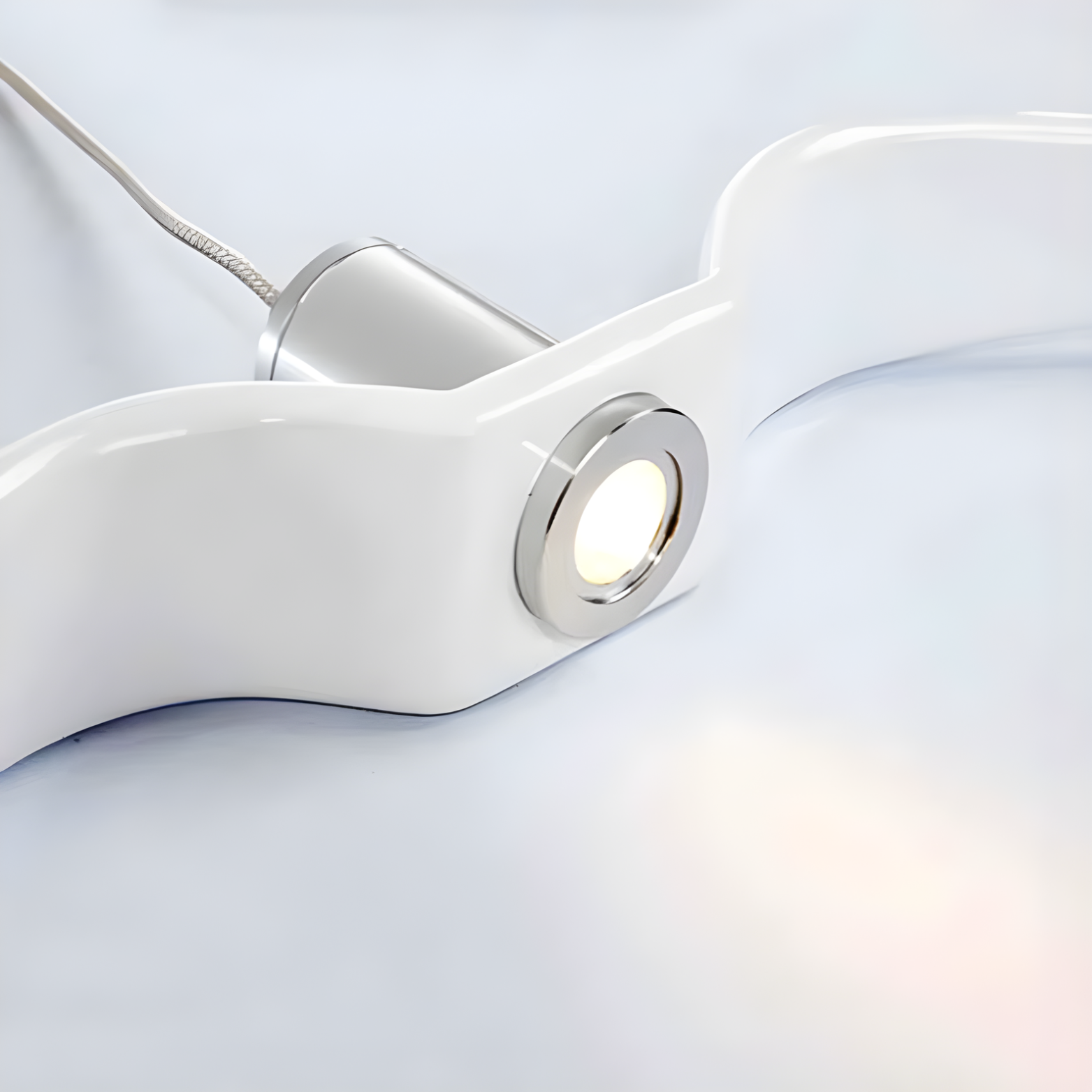 Close-up of a white lamp with a light on a light gray background