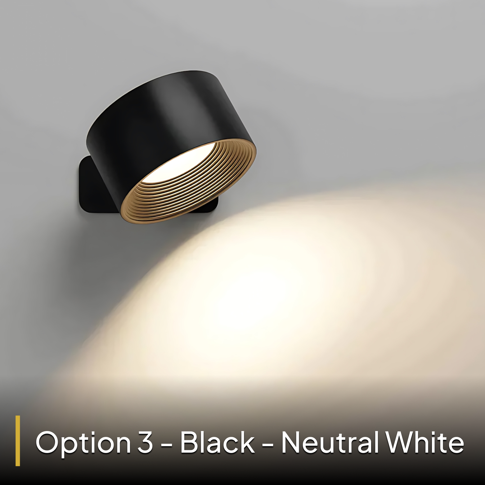Modern wall light fixture with black and gold design on a gray background