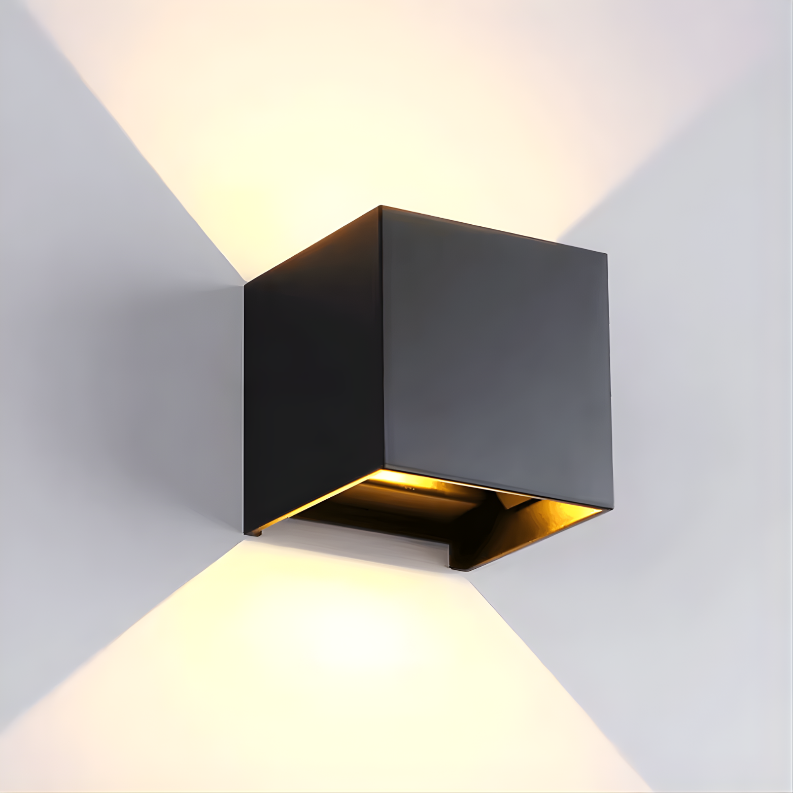 Modern black wall light fixture on a gray wall