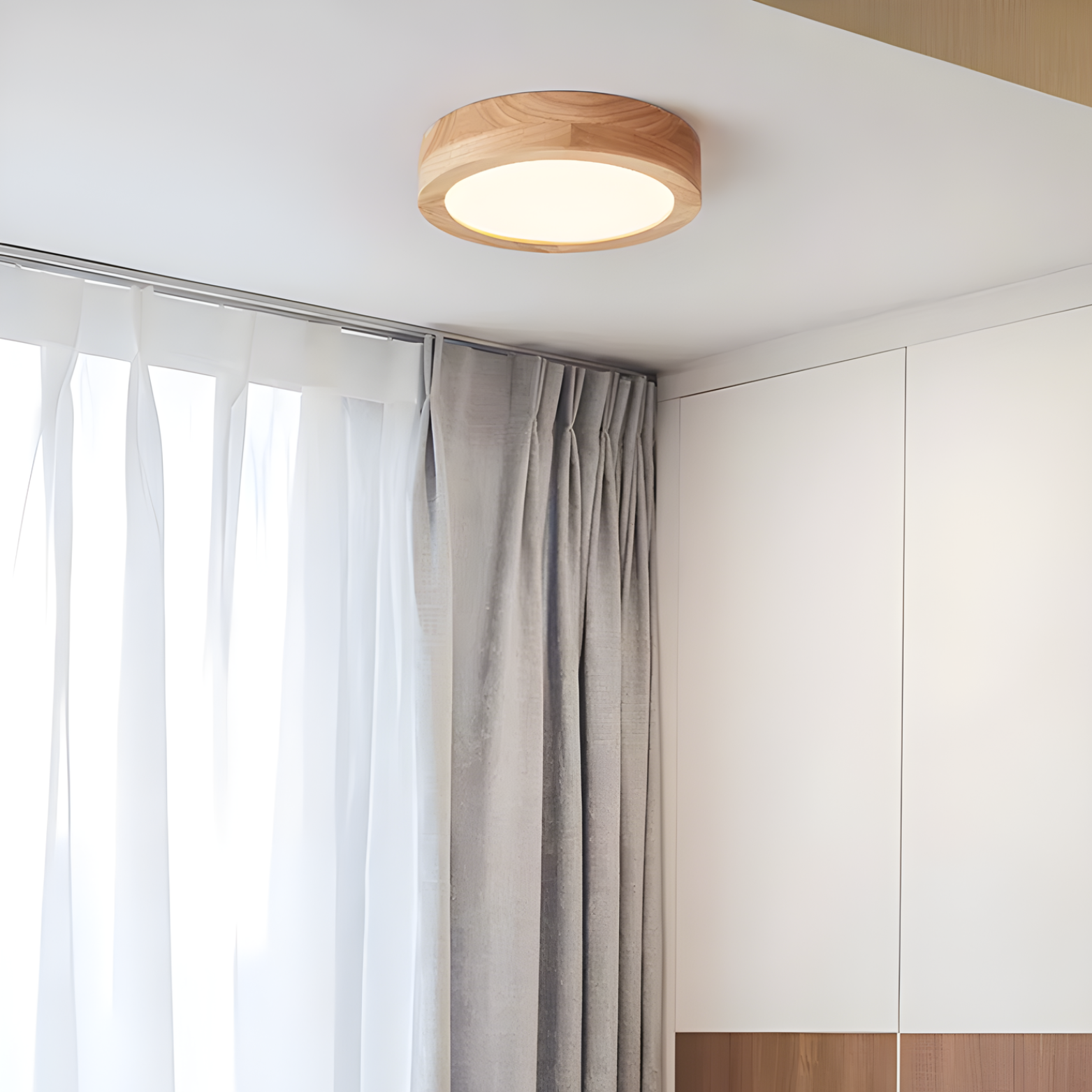 Wooden ceiling light fixture in a room with curtains and white walls
