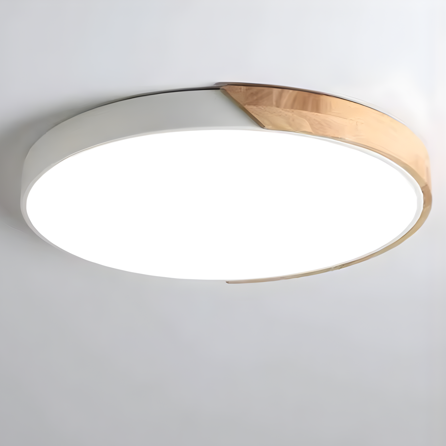 Ceiling light fixture with white and gold design on a plain background