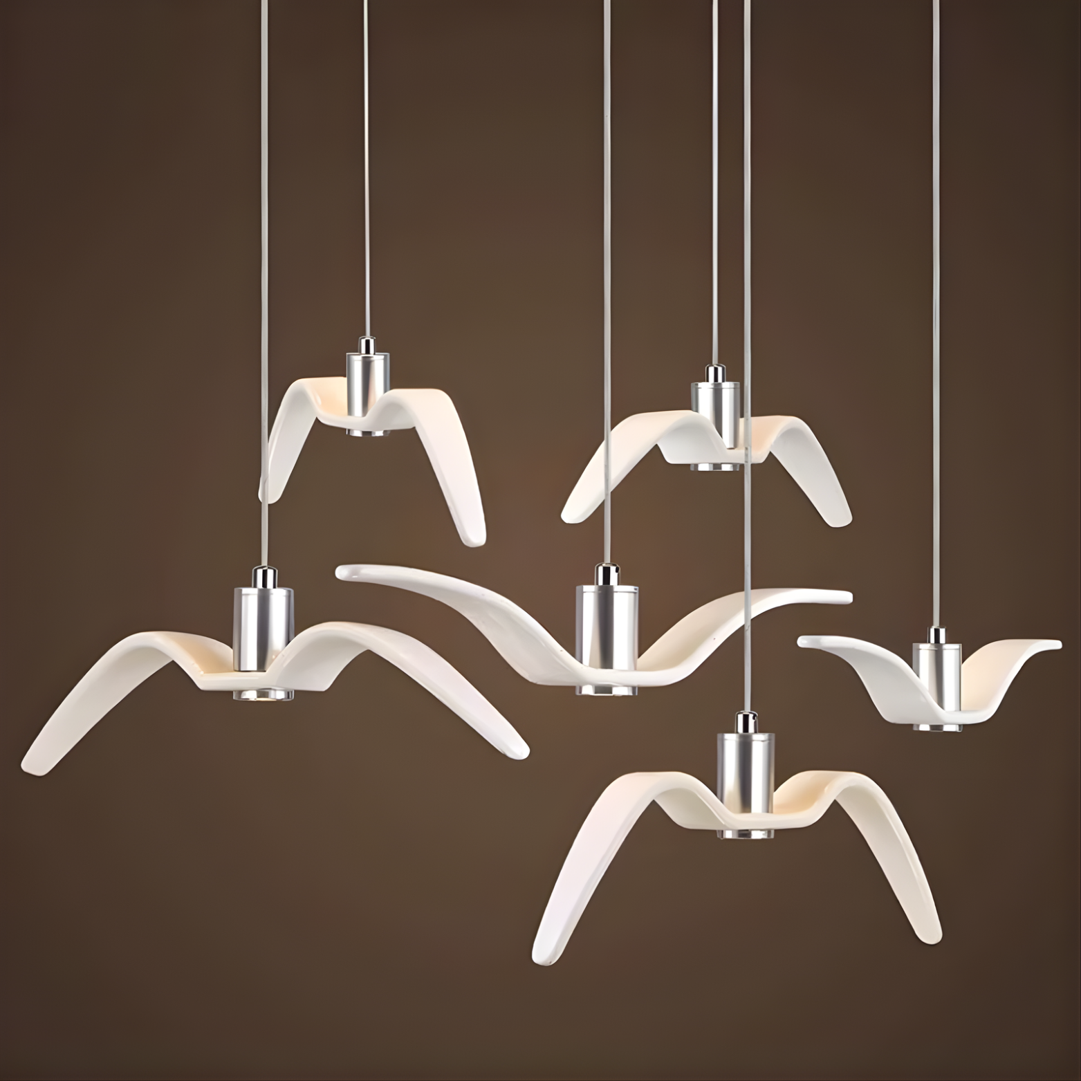 Five bird-shaped pendant lights on a brown background