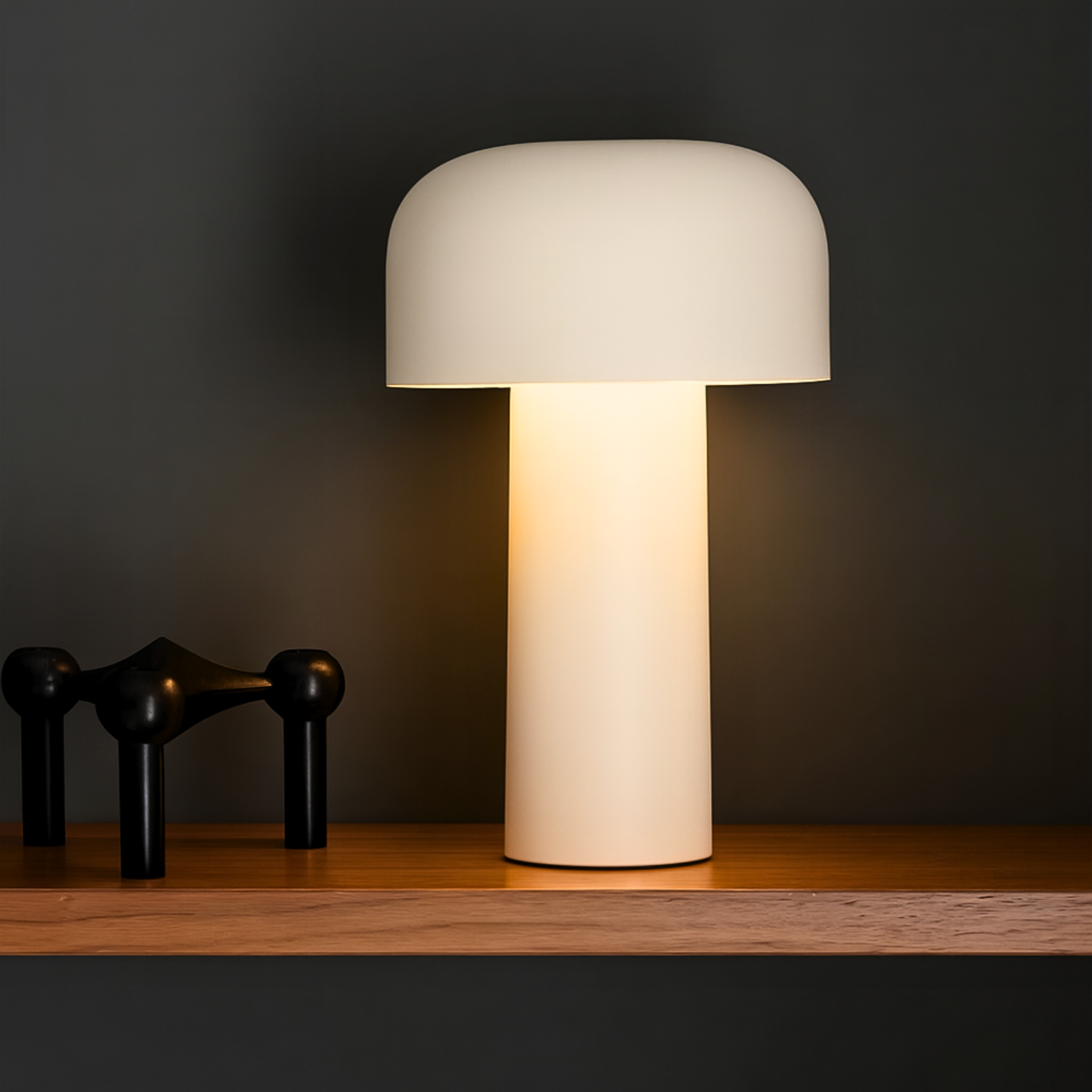 Beige table lamp on a wooden surface with a dark background