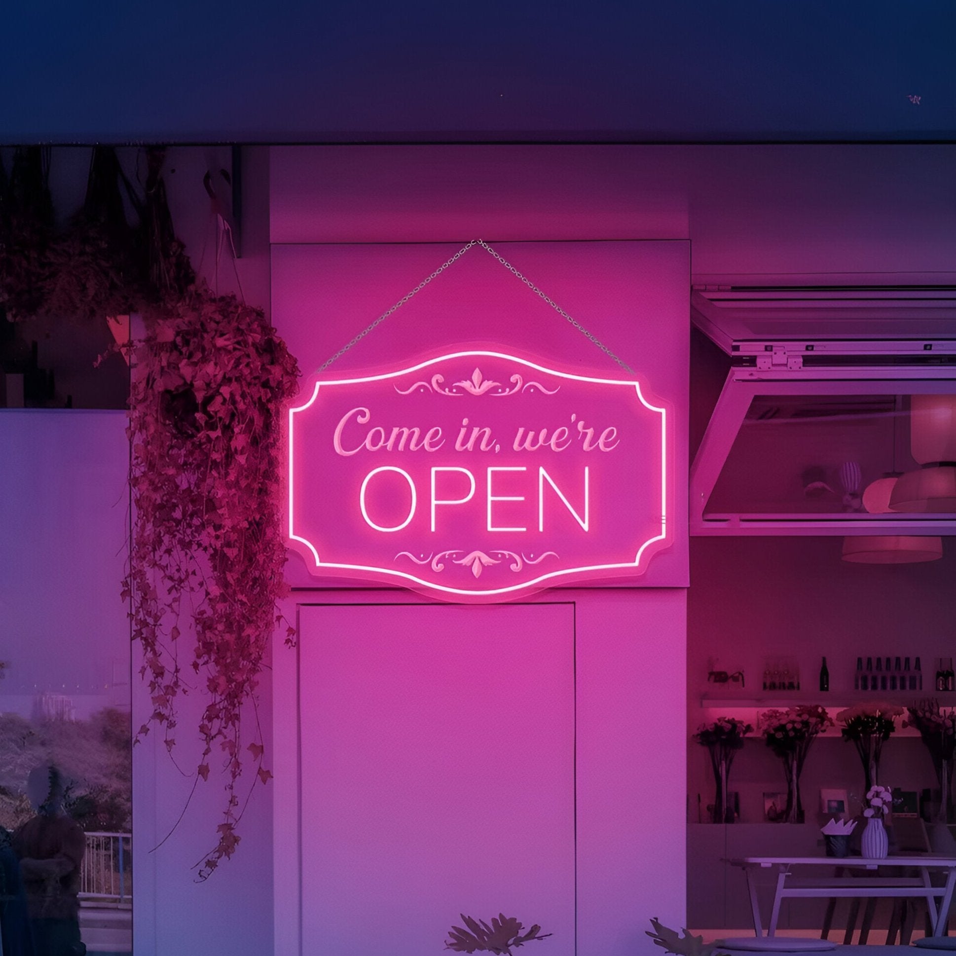 We're open pink neon sign