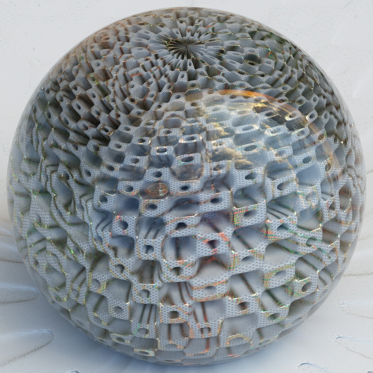 a ball with a pattern on it sitting on a white surface