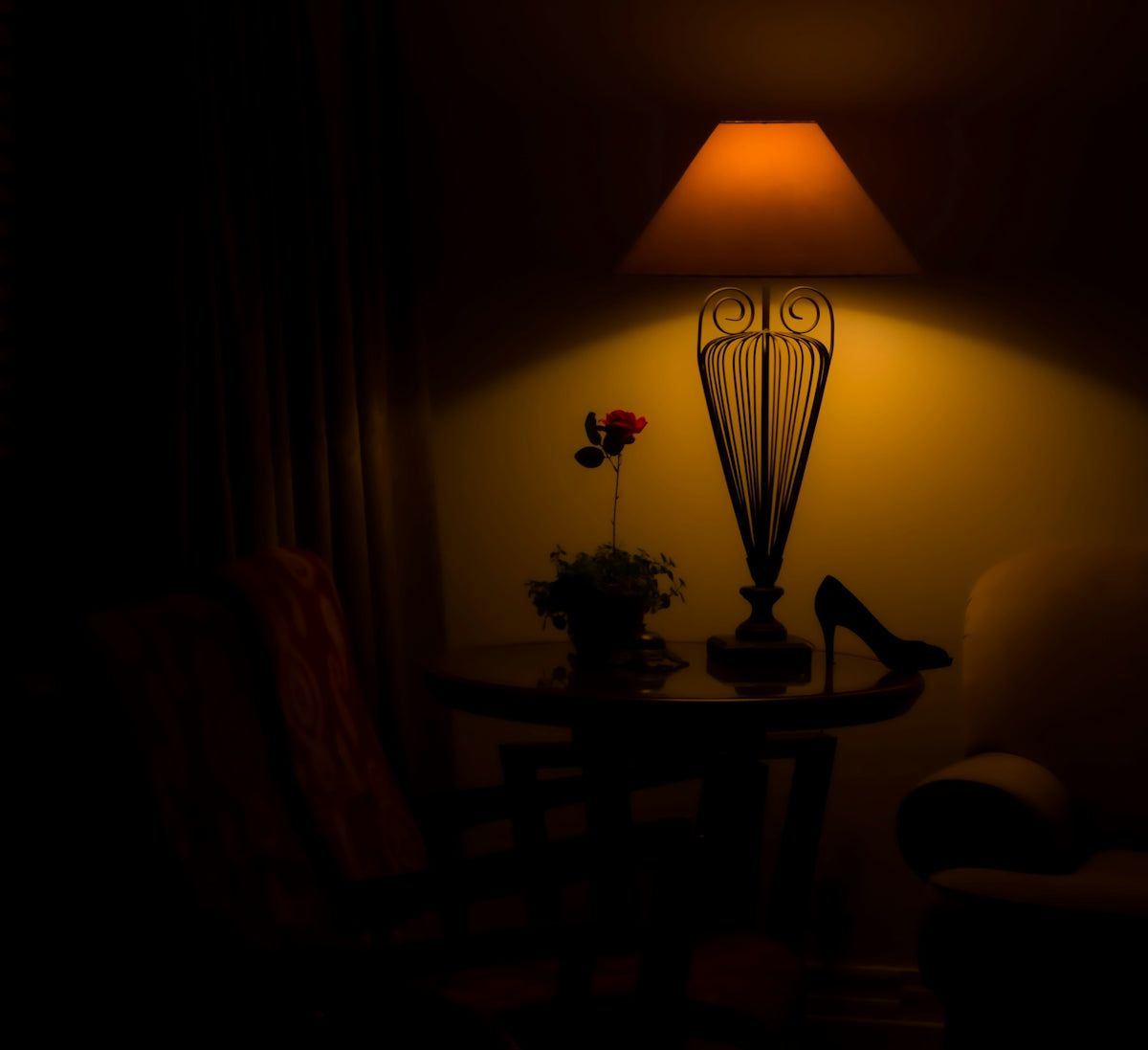 a chair and a table in a dark room