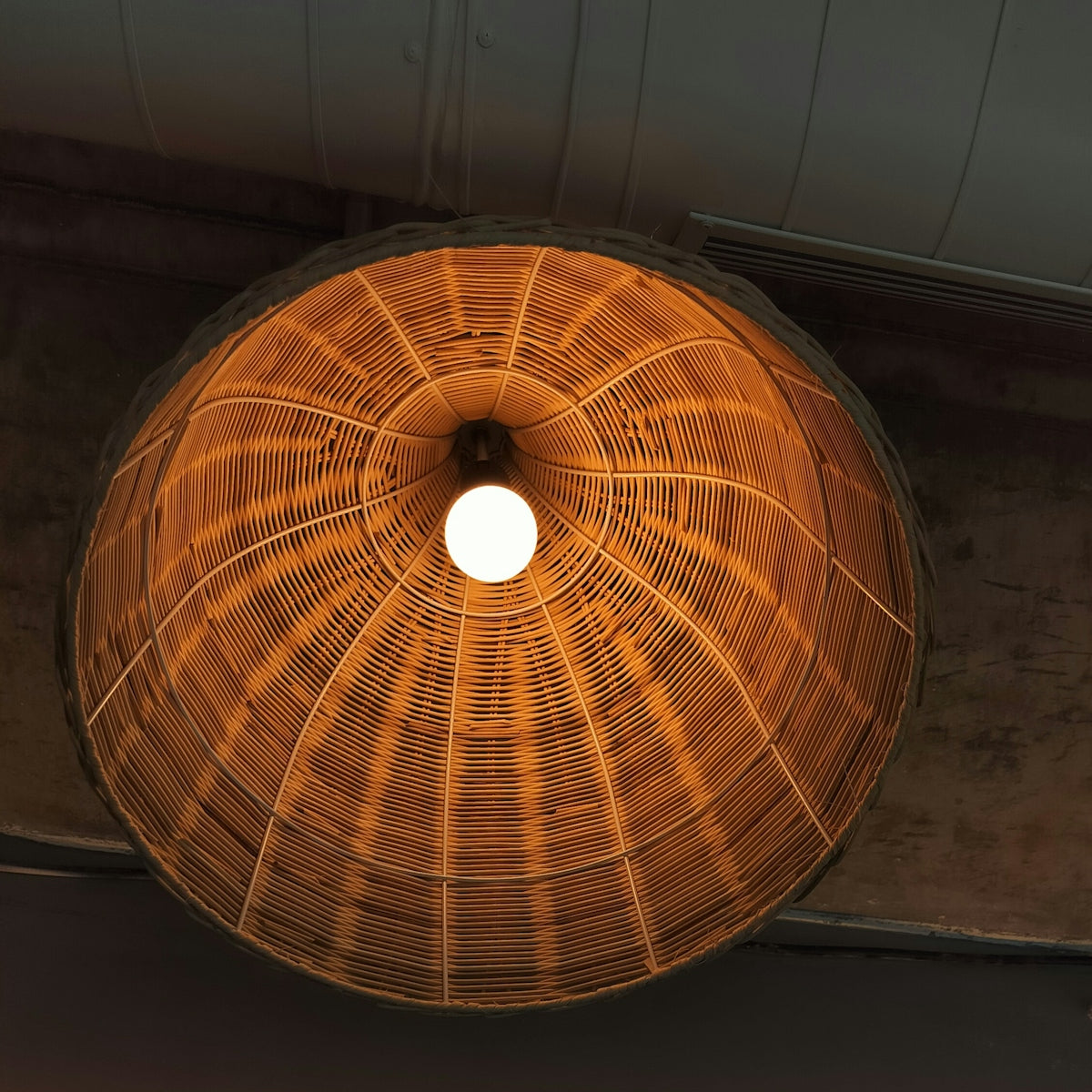 a lamp hanging from a ceiling in a room