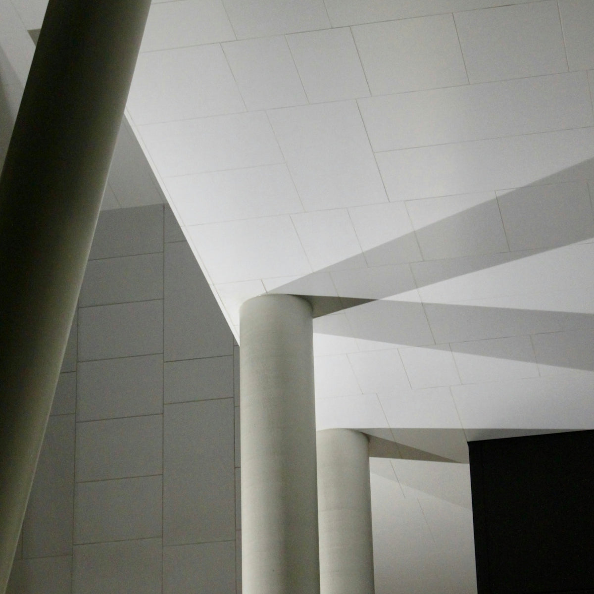 A building with columns and a clock on the wall