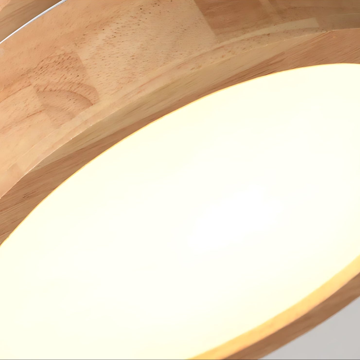 Wooden light fixture with a warm glow on a white background