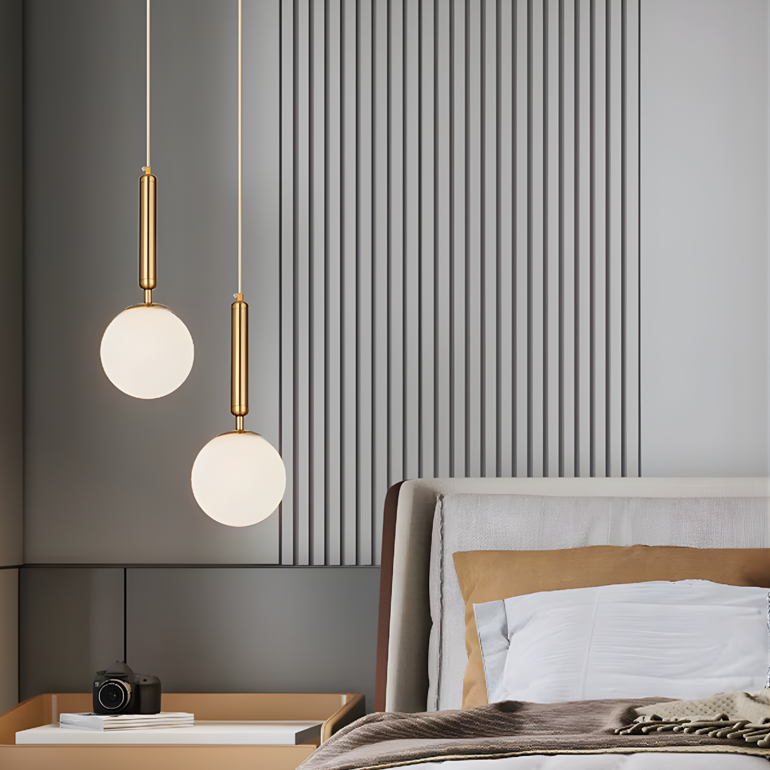 Modern bedroom with pendant lights, bed, and side table.