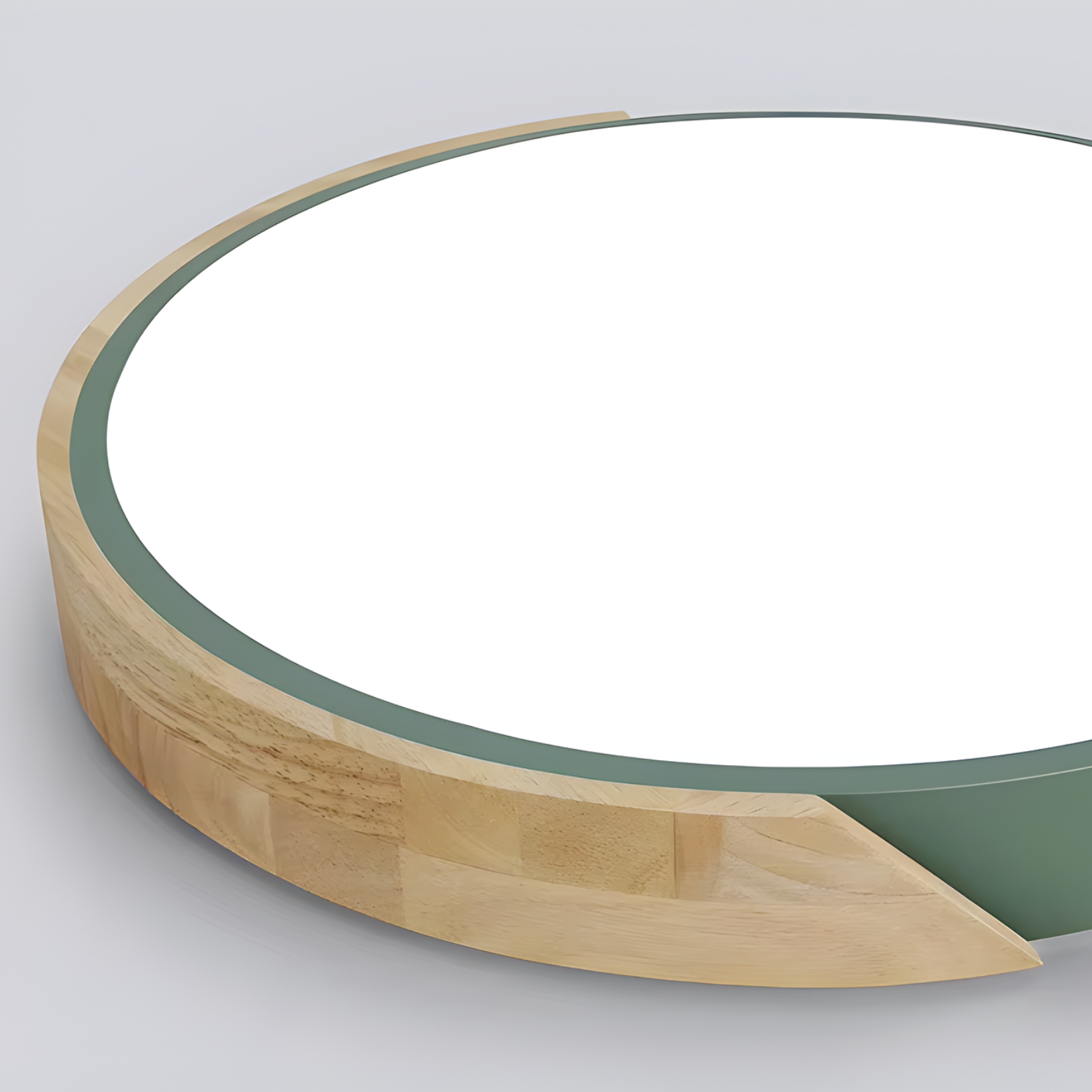 Circular object with wooden edge and green interior on a gray background