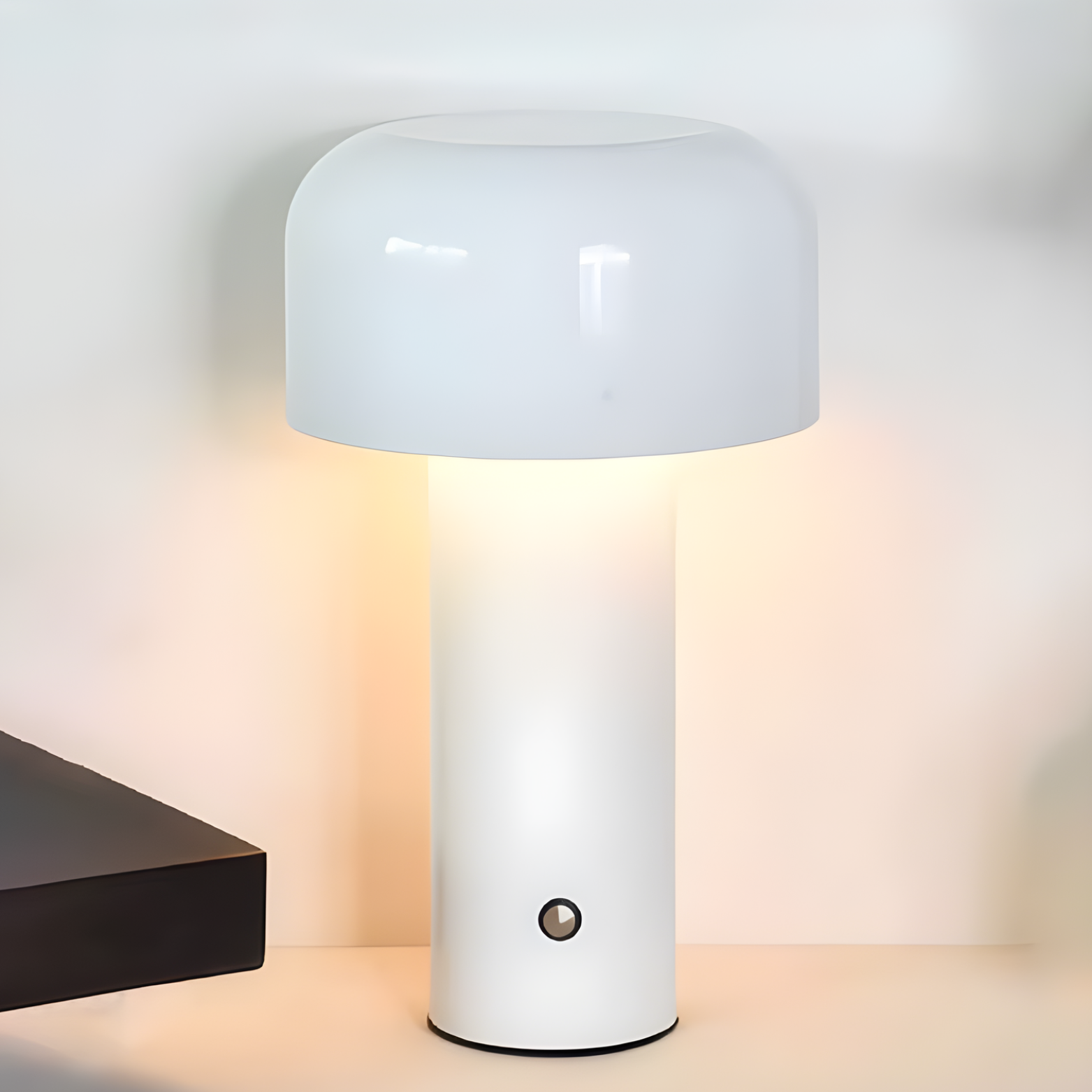 White cylindrical lamp with a light on a neutral background
