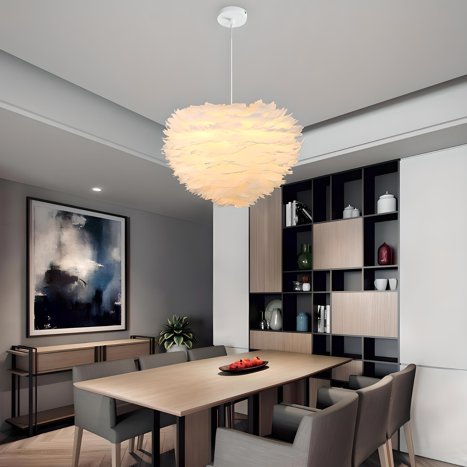 Modern dining room with a pendant light fixture, table, chairs, and decorative elements.
