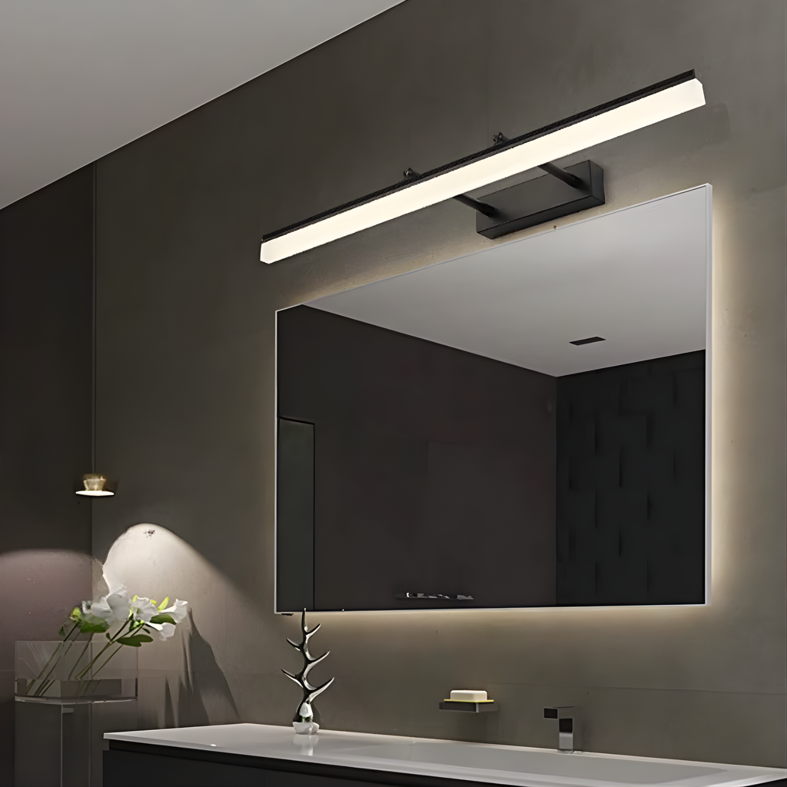 Bathroom setup with a large mirror and modern light fixture.