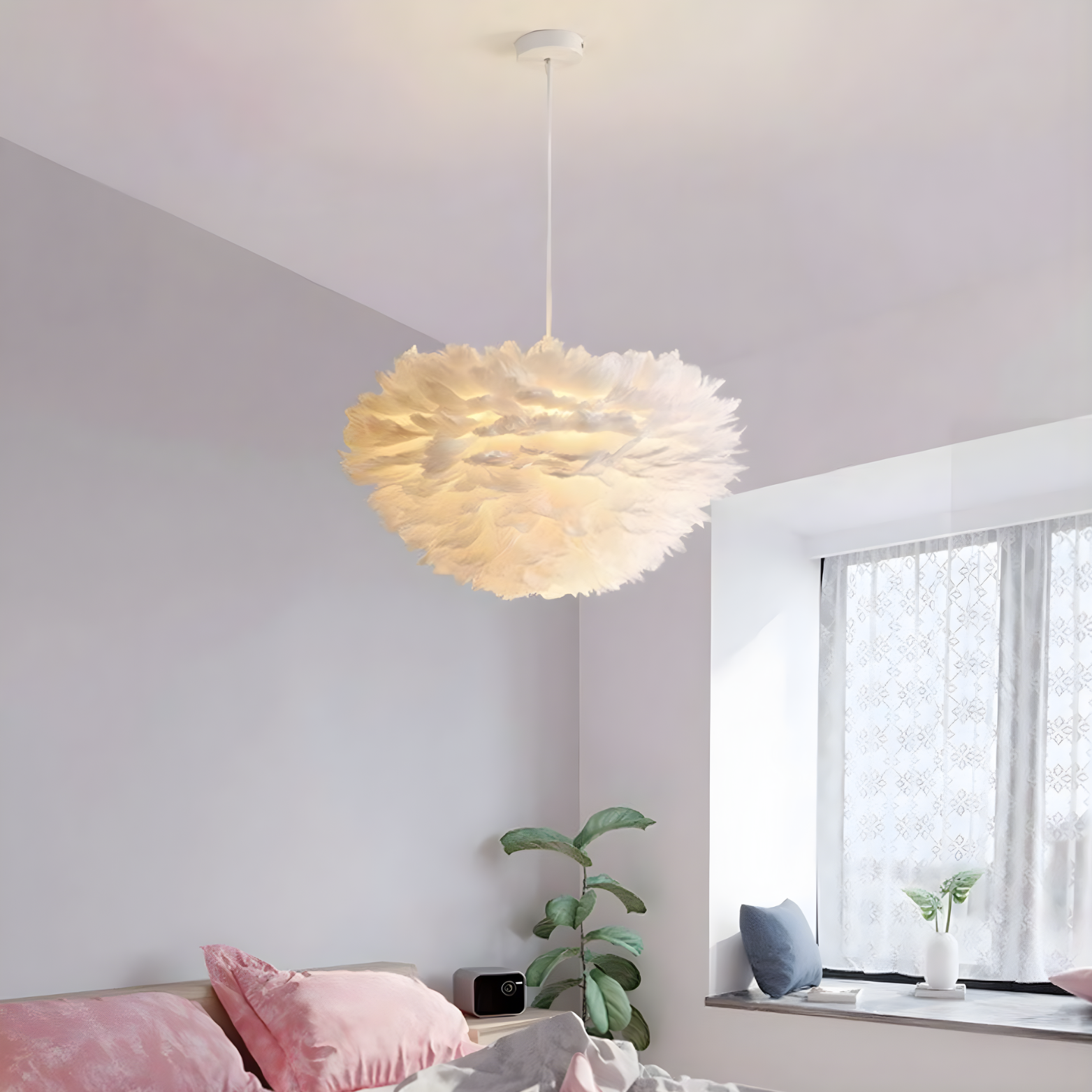 Modern pendant light hanging in a room with a window and decorative pillows.