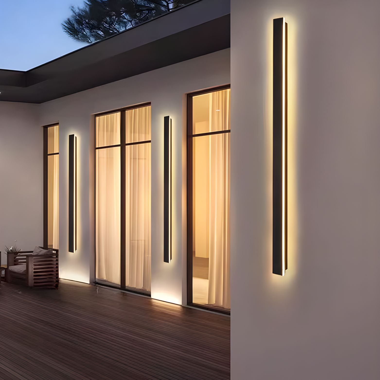 Modern outdoor wall lights on a house exterior at night