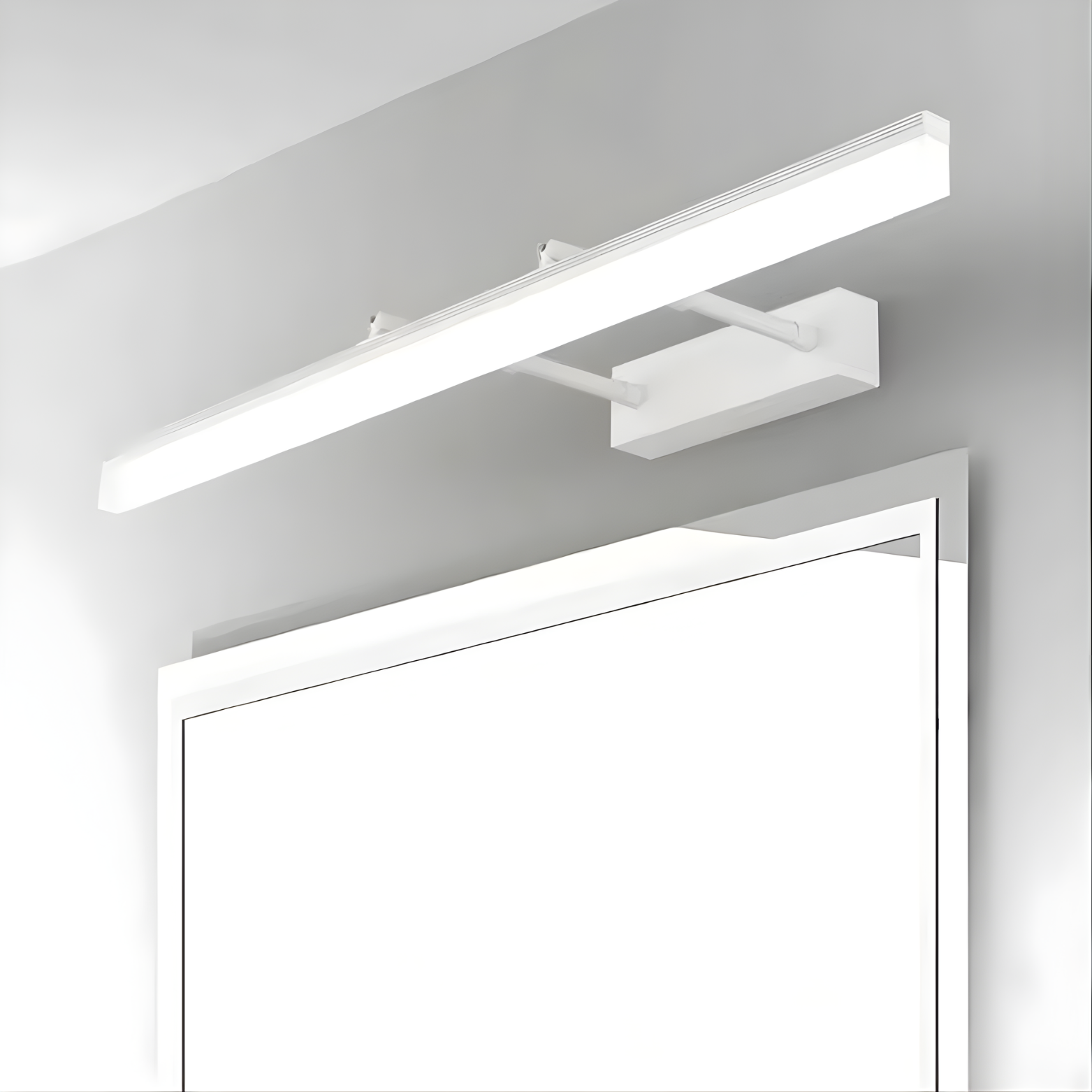 Modern LED ceiling light fixture above a mirror in a bathroom setting.