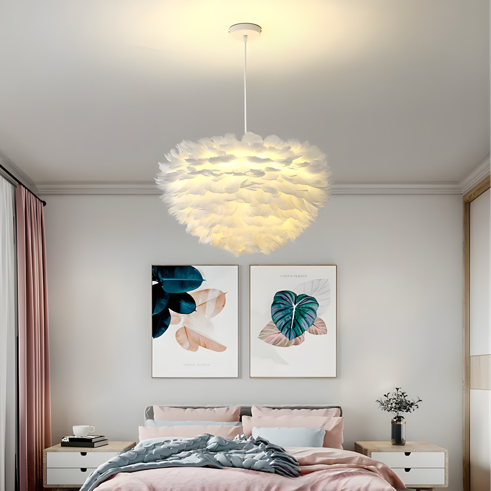 Modern pendant light hanging in a bedroom with floral wall art and a bed.
