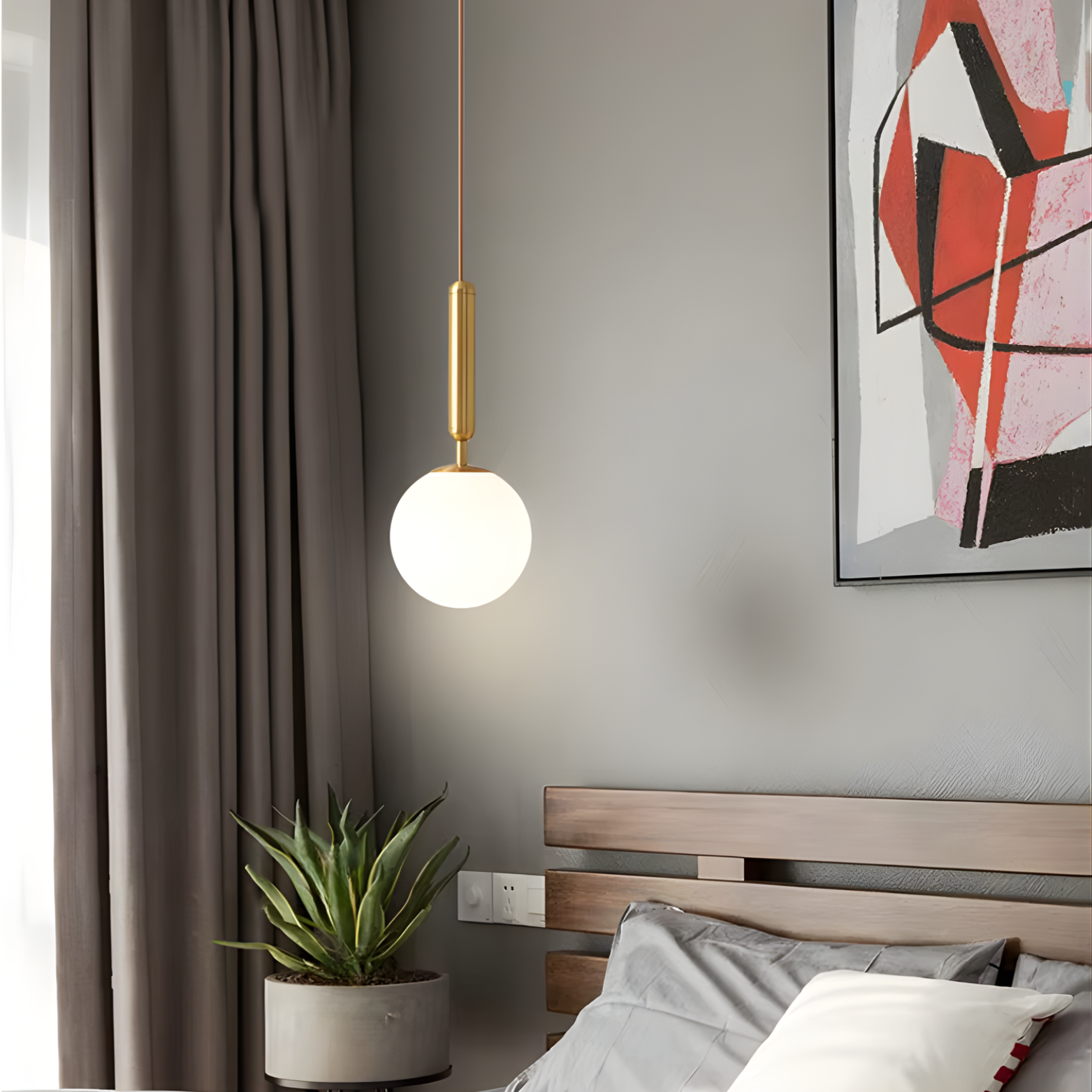 Modern bedroom with a pendant light, plant, and abstract art on the wall.
