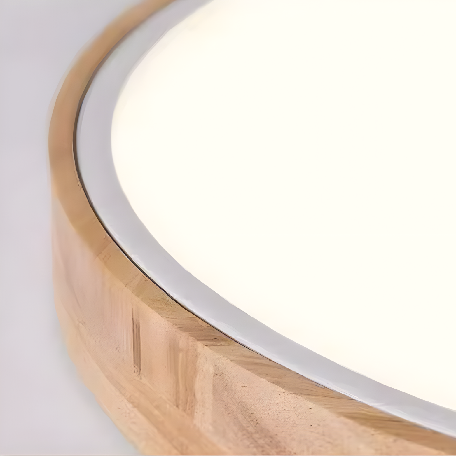 Round mirror with wooden frame on a white background