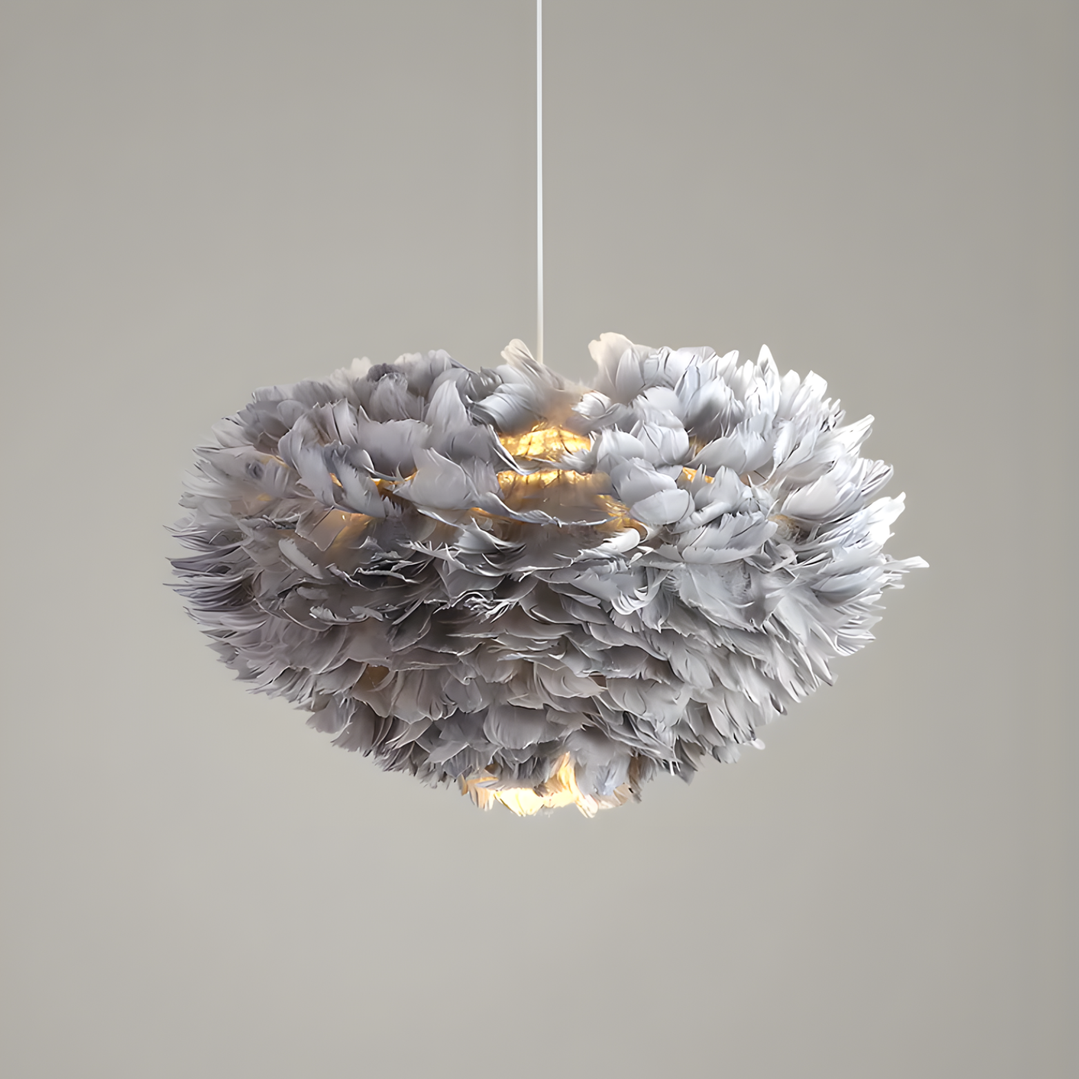 Feathered pendant light fixture on a plain background