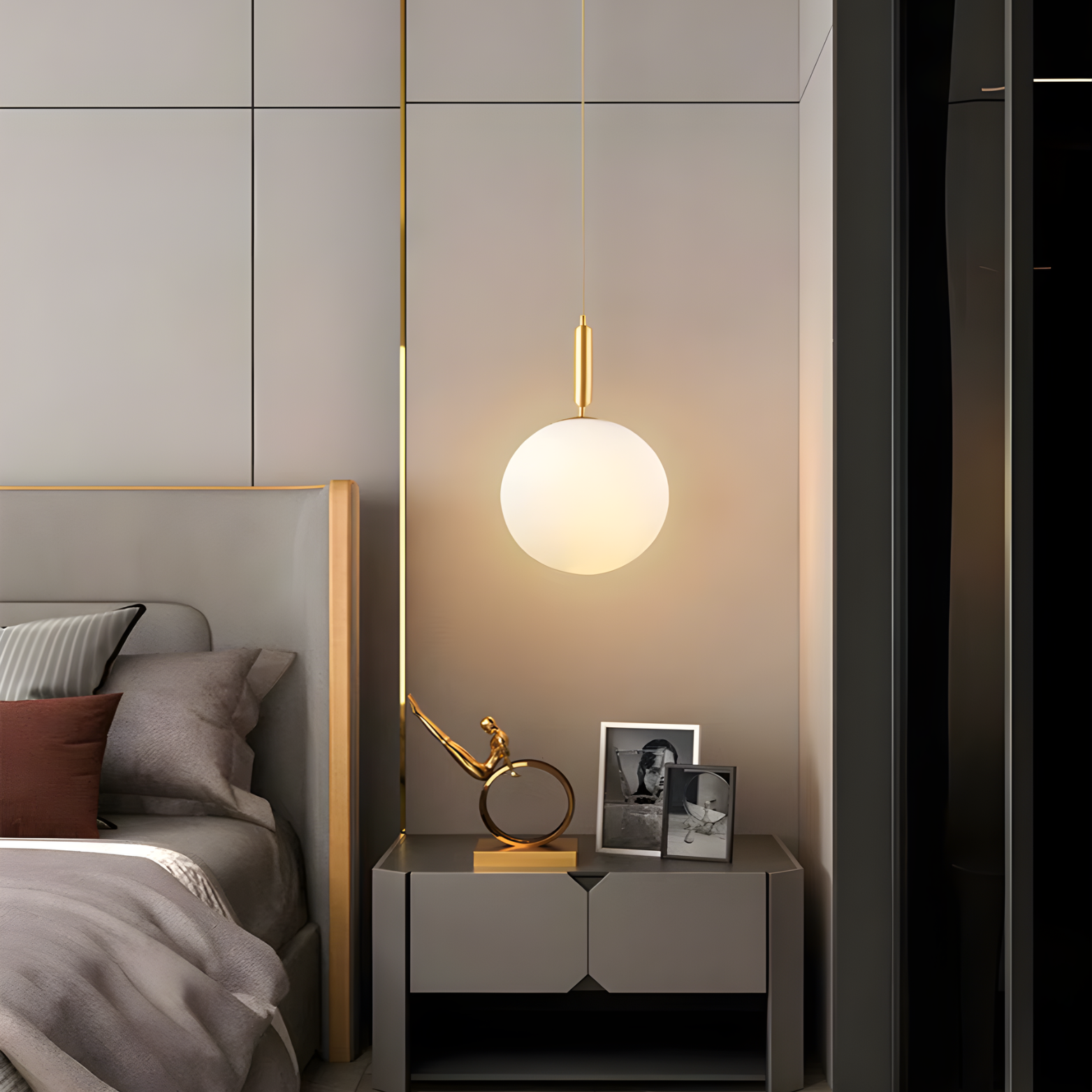 Modern bedroom with a bedside table, lamp, and decor items.