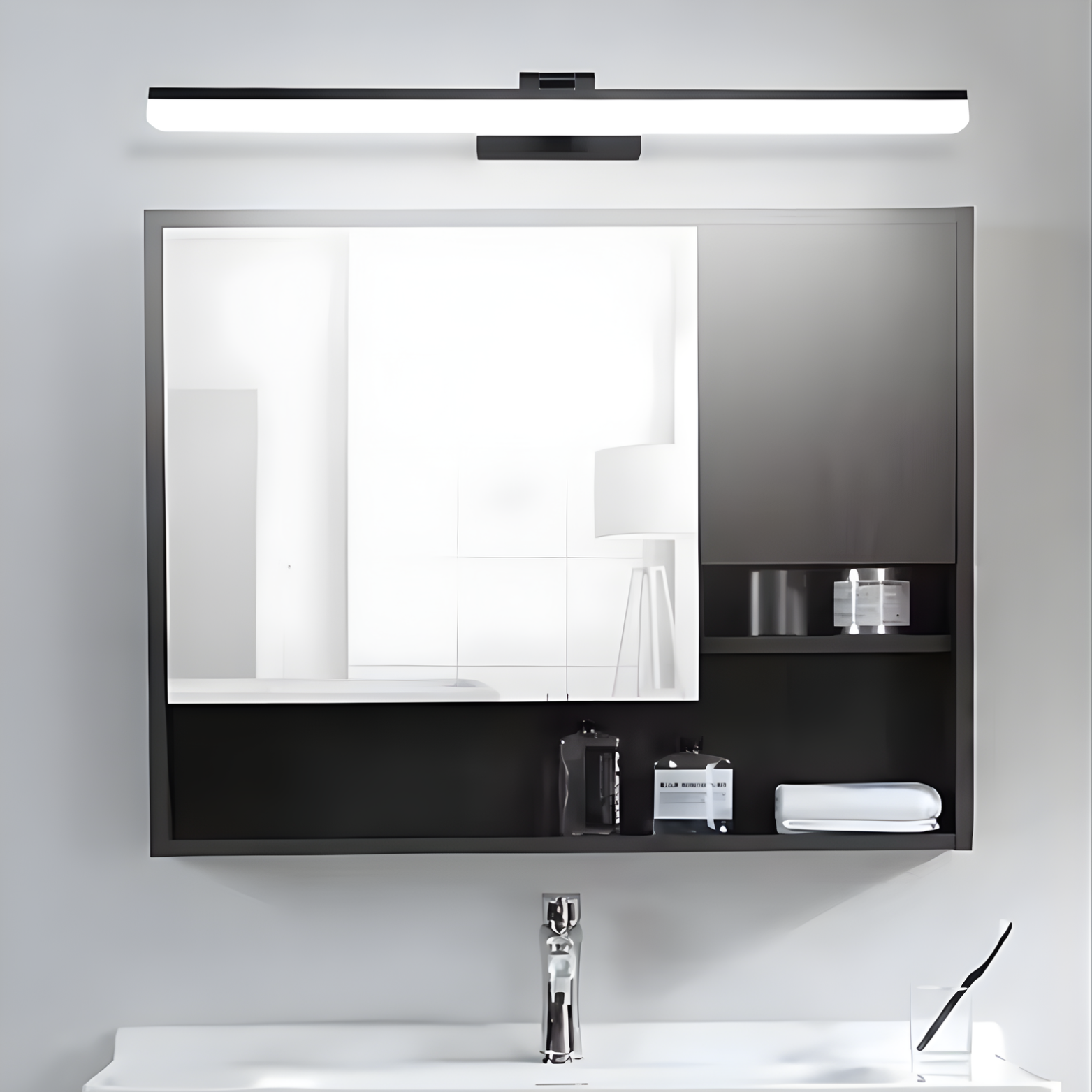 Bathroom setup with a mirror cabinet, sink, and light fixture.
