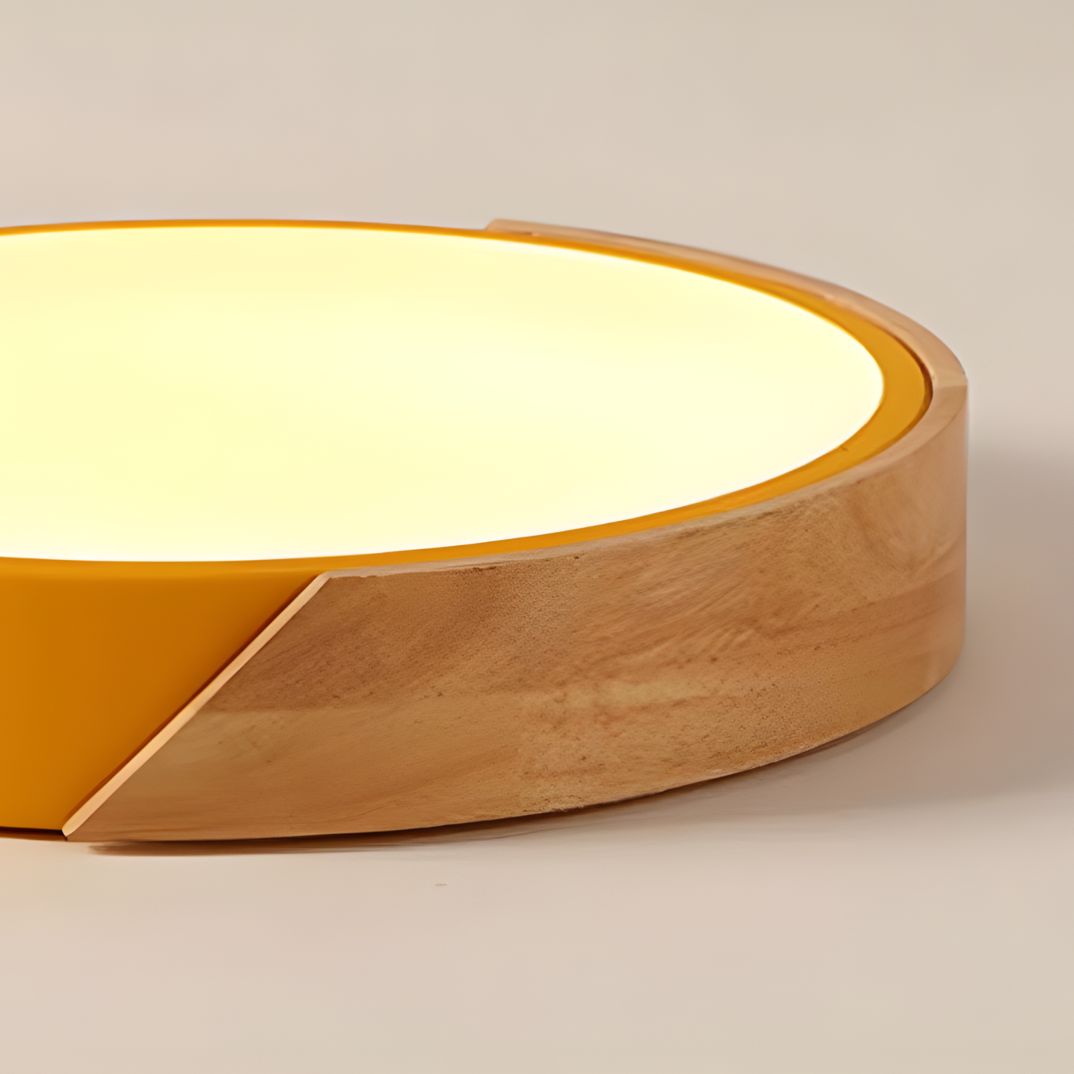 Round lamp with yellow interior and wooden exterior on a beige background