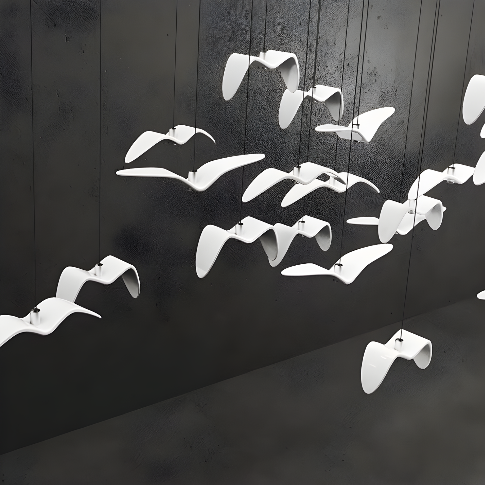 White bird-shaped sculptures on a black wall