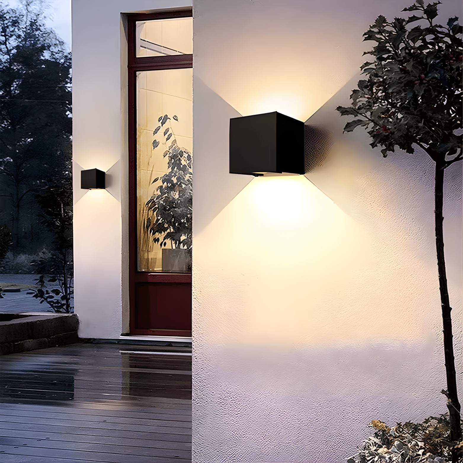Outdoor wall lights on a building exterior with plants and a wooden deck.