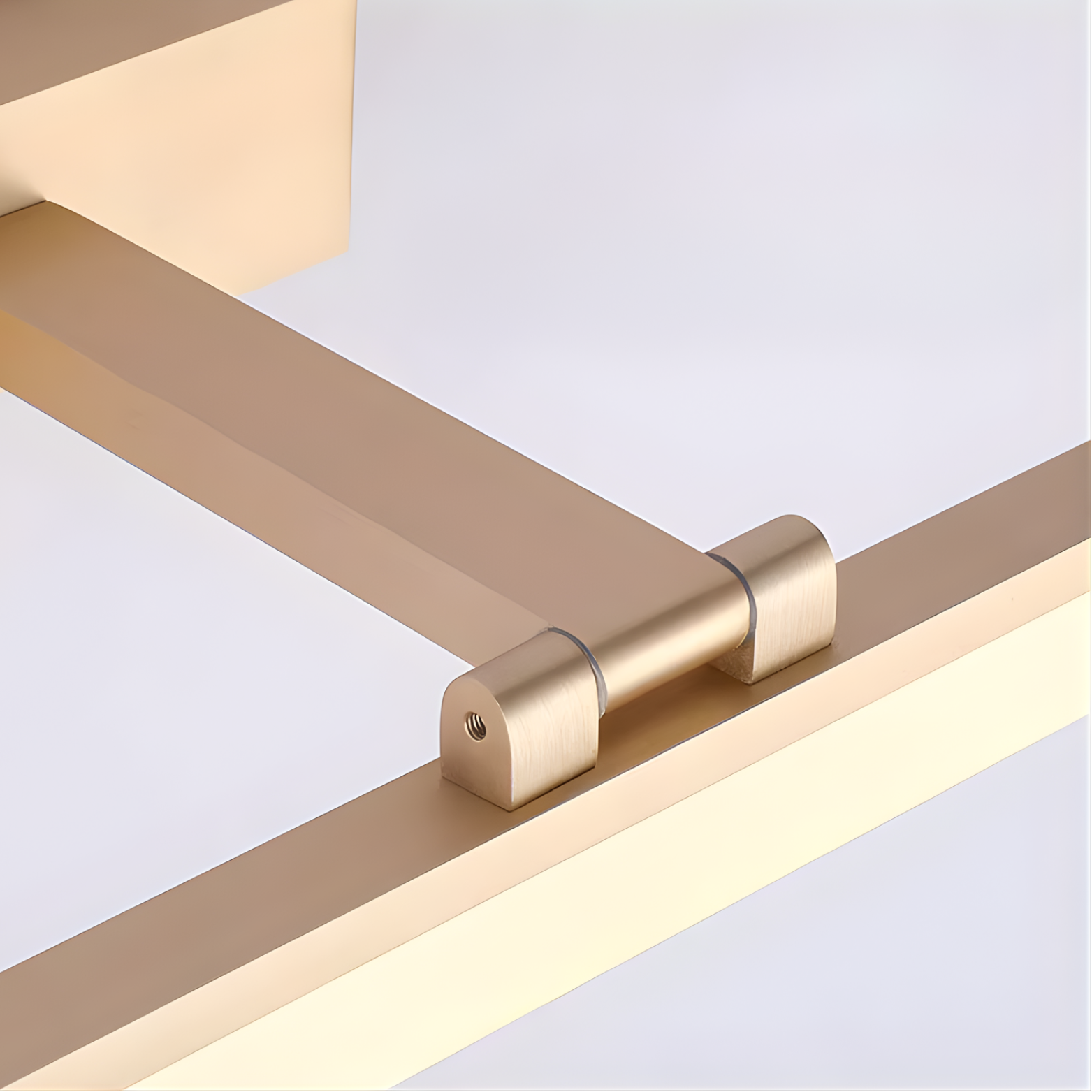 Gold metal frame with geometric design on a light gray background