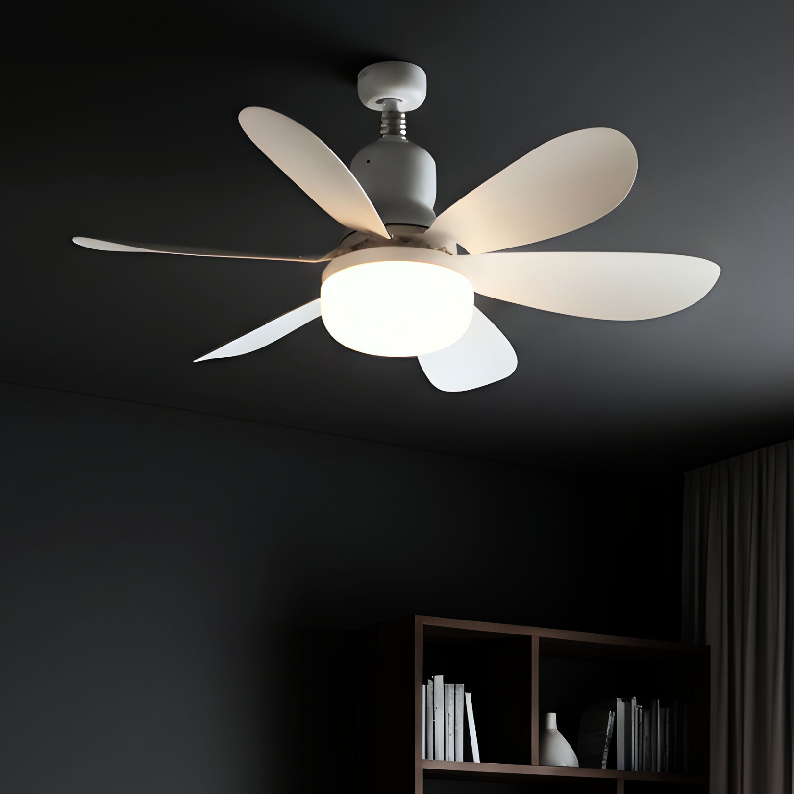 Ceiling fan with light fixture on a dark ceiling
